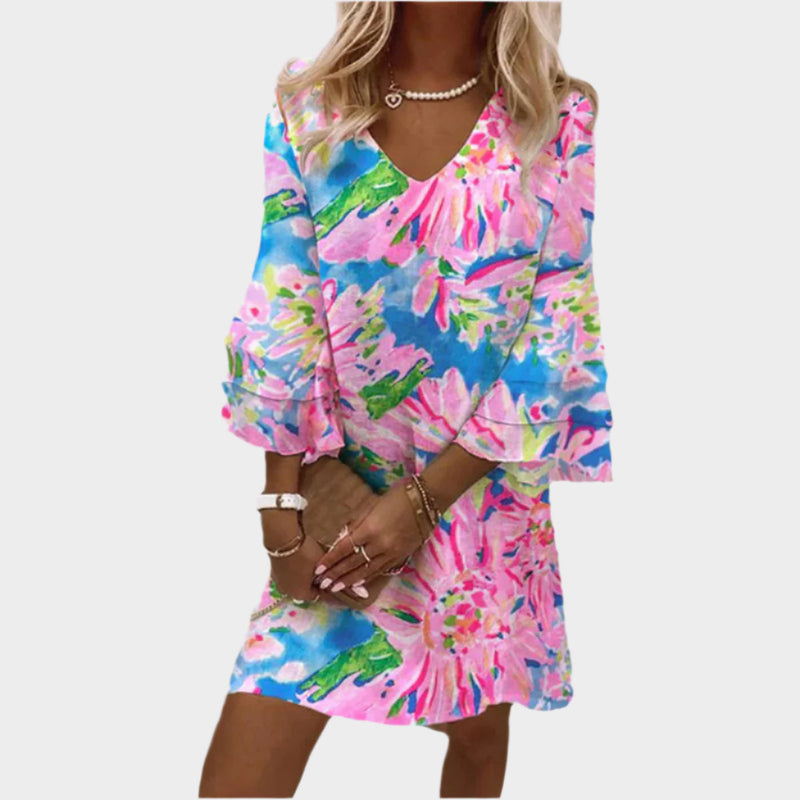 Elegante miniabito rosa con maniche curve