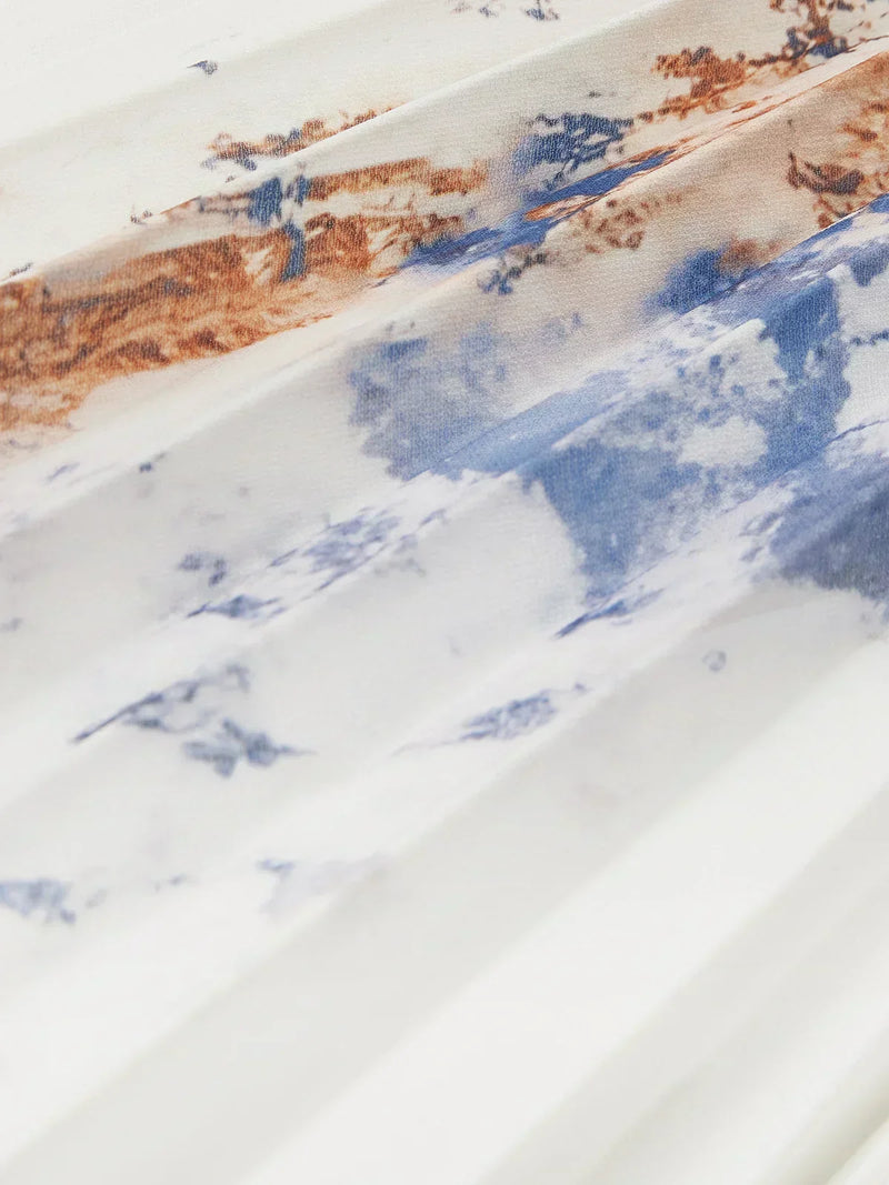 Abito lungo con maniche a sbuffo e scollo a V